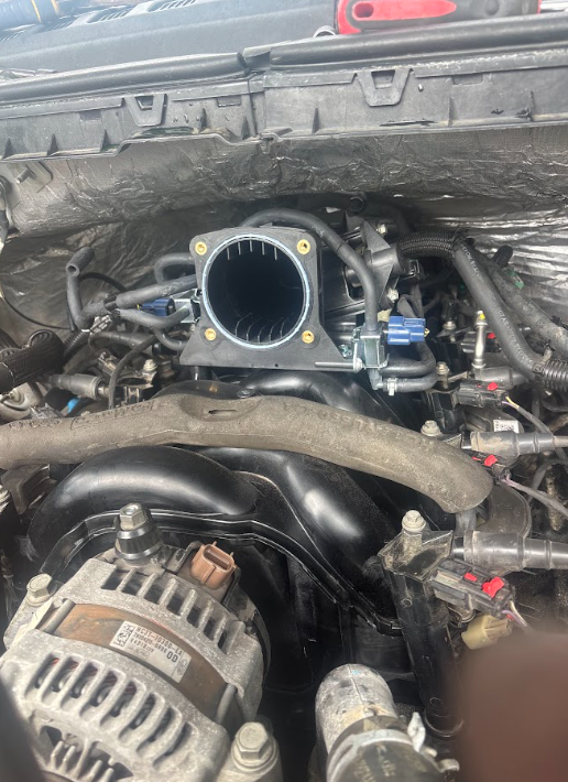 Engine bay with the intake and throttle body removed