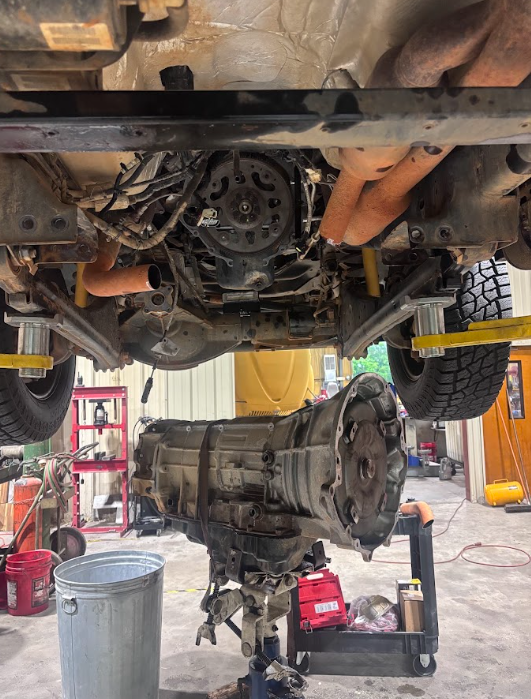 Transmission lowered out on a jack