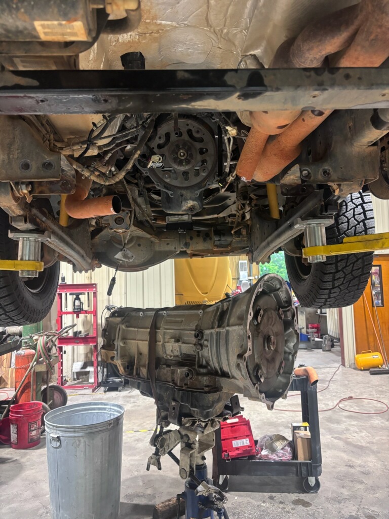 Transmission out from under a truck on the lift